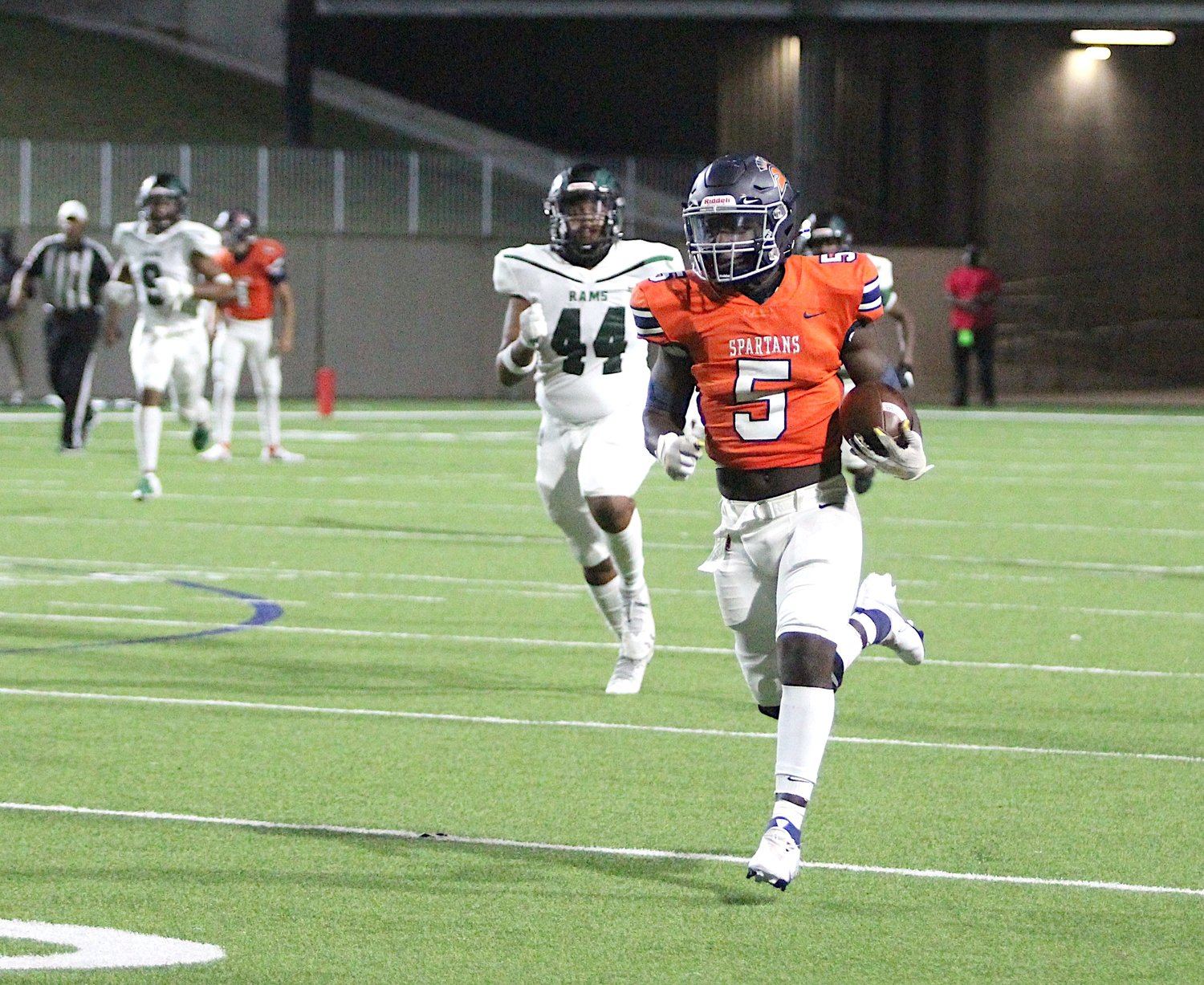 Seven Lakes senior running back Nick David-West runs for a 68-yard catch-and-run touchdown during the Spartans' win over Mayde Creek on Nov. 13 at Legacy Stadium.